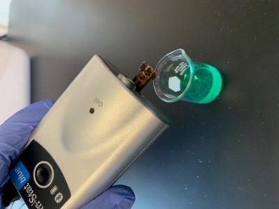 NIFA-funded nanosensor connected to a portable potentiostat to monitor pesticides in a sample fluid image